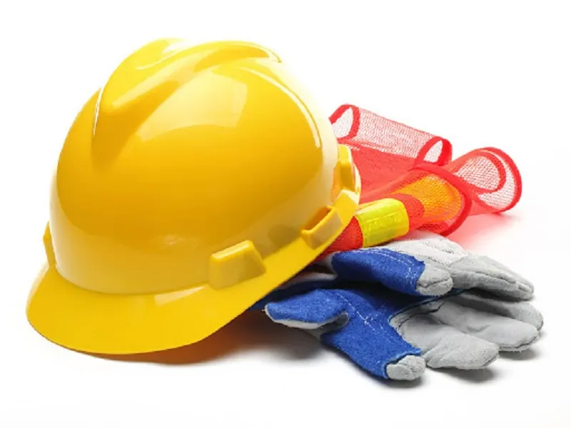 Yellow safety helmet, gloves and high-visibility vest